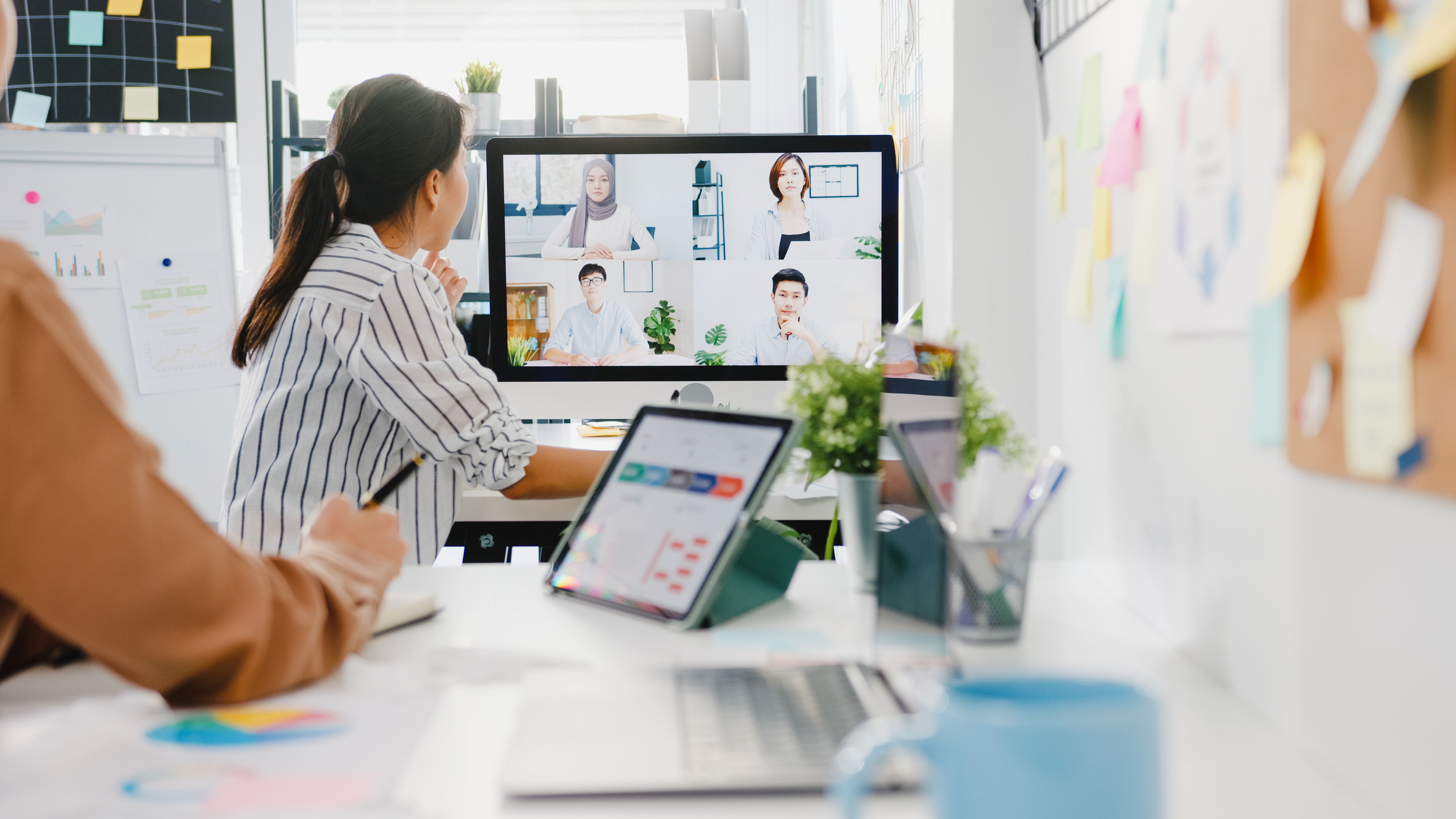 Asia businesspeople using desktop talk to colleagues discussing